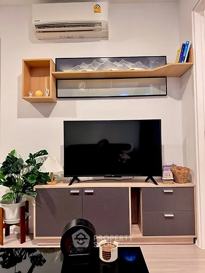 Modern living room with sleek TV unit and stylish wall shelves