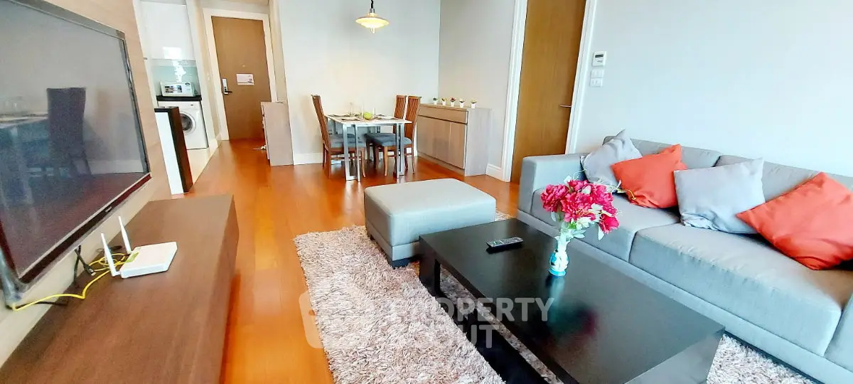 Spacious modern living room with cozy seating and dining area, perfect for relaxation and entertainment.