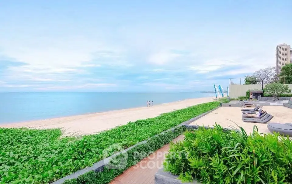 Stunning beachfront property with lush greenery and serene ocean views, perfect for luxury living.
