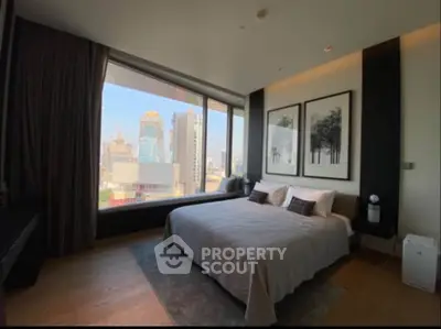 Luxurious bedroom with stunning city view and modern decor