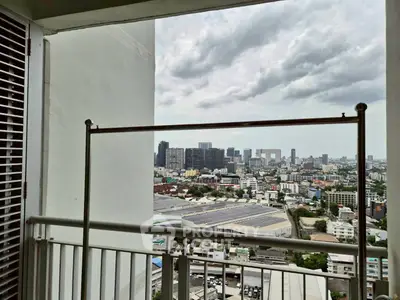 Stunning cityscape view from high-rise balcony with modern railing