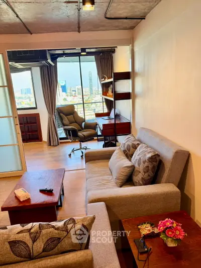 Stylish living room with city view, modern furniture, and cozy ambiance in urban apartment.