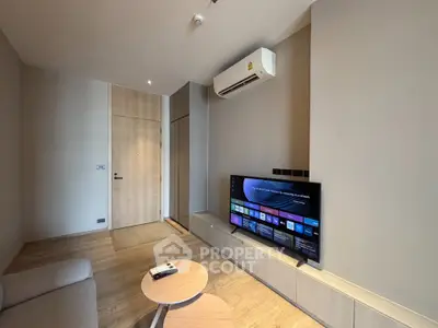 Modern living room with sleek TV setup and air conditioning