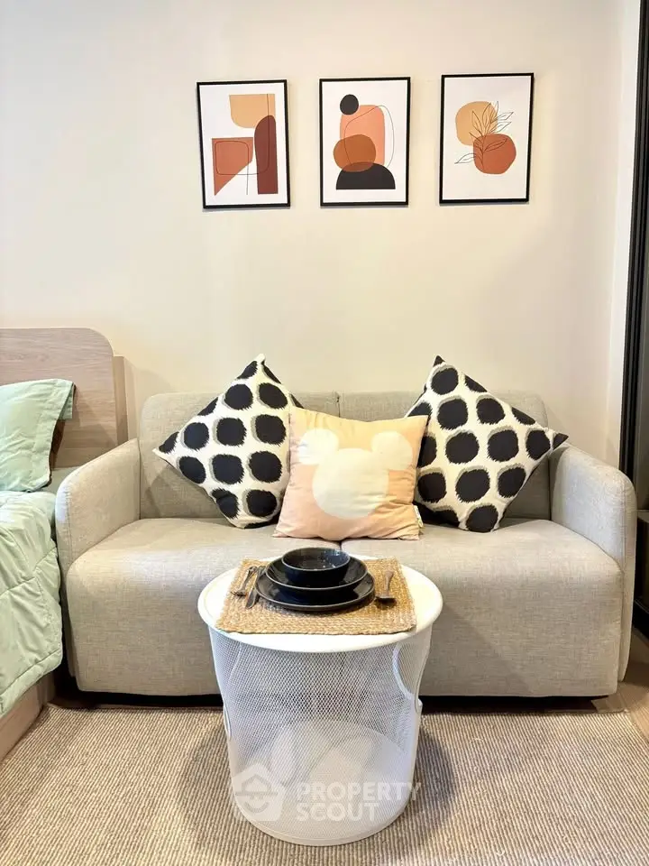 Chic living room with modern decor and cozy sofa, perfect for relaxation.