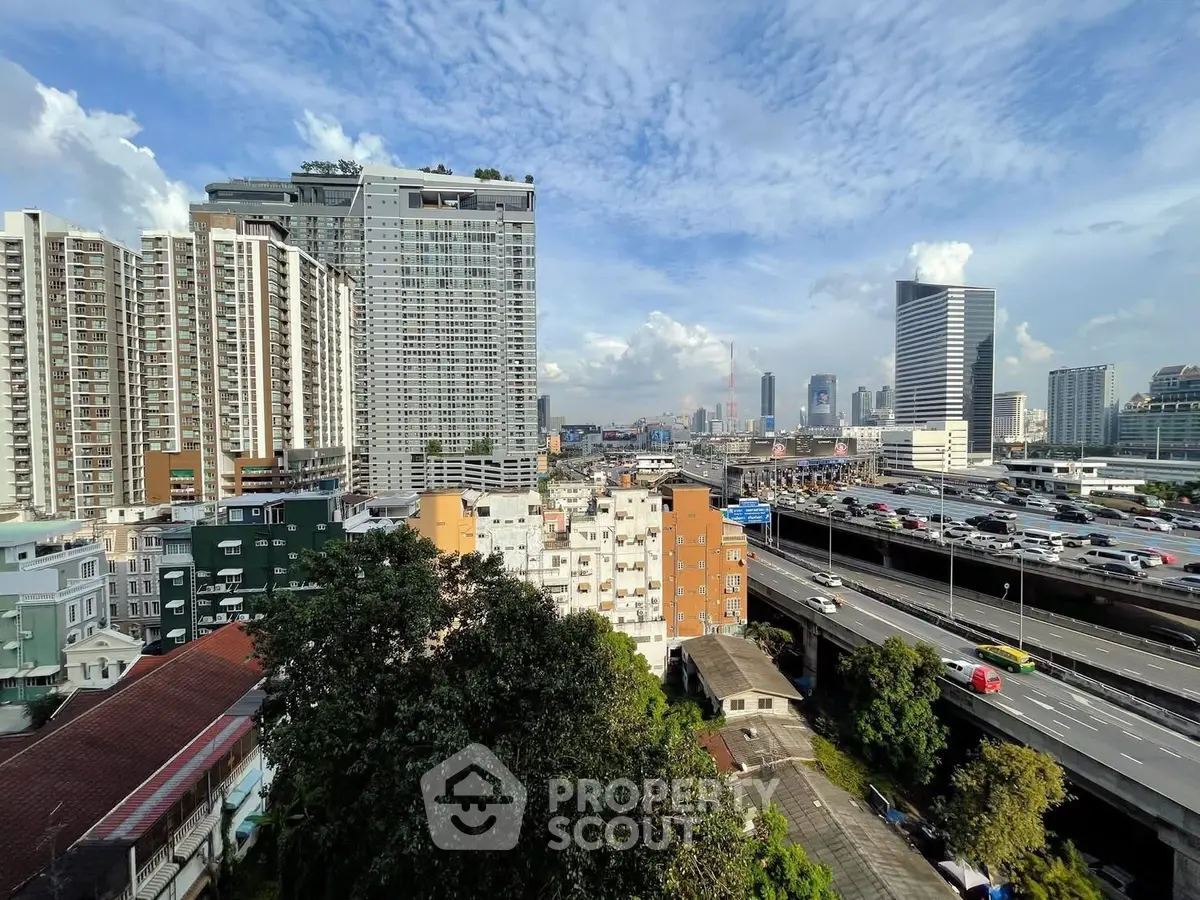 Stunning cityscape view with modern high-rise buildings and lush greenery, perfect urban living.