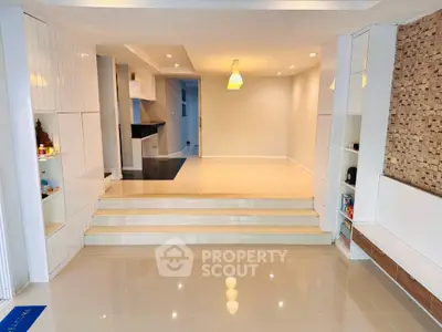 Spacious modern living room with sleek design and elegant lighting