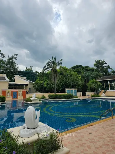 Luxurious outdoor pool with elegant landscaping and serene ambiance