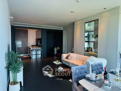 Luxurious modern living room with elegant decor and open kitchen layout, perfect for stylish urban living.
