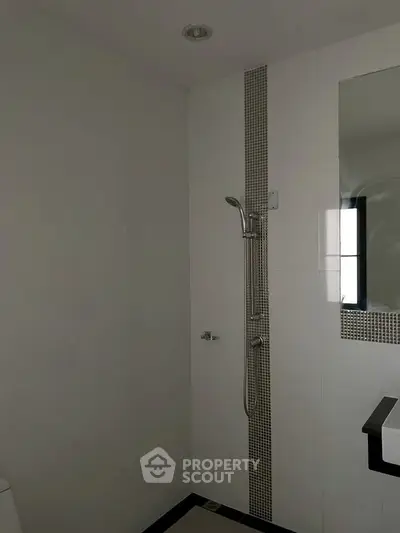 Modern bathroom with sleek shower and minimalist design