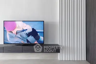 Modern living room with sleek TV unit and minimalist decor