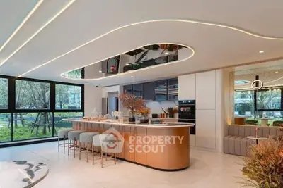 Luxurious modern kitchen with open layout and stylish island in a bright, spacious setting.