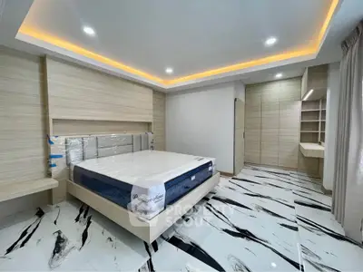 Luxurious modern bedroom with stylish marble flooring and ambient lighting