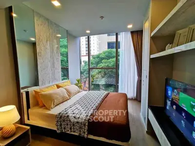 Modern bedroom with large window and stylish decor in urban apartment