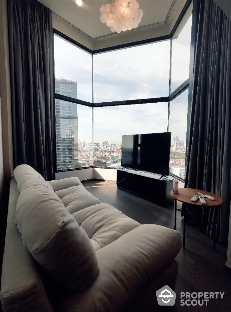 Luxurious corner unit living room with panoramic city view and modern furnishings.