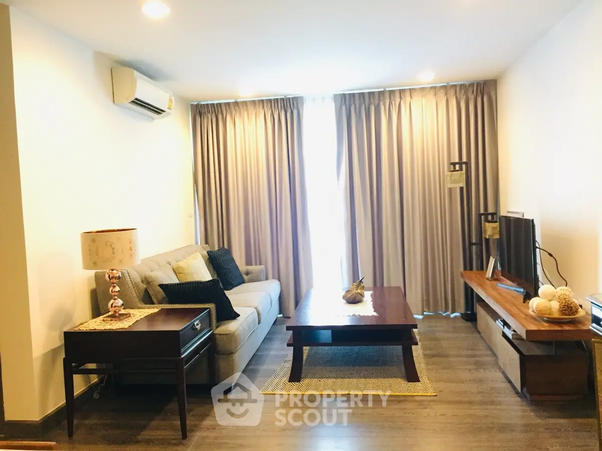 Spacious living room with elegant decor and natural light