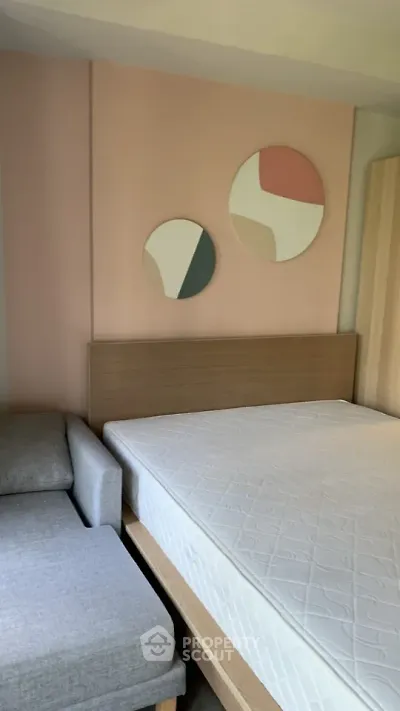 Modern bedroom with stylish decor and comfortable bed in a cozy apartment.