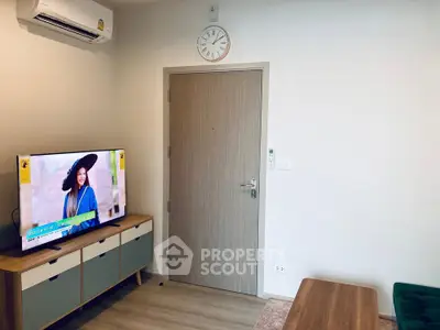 Modern living room with stylish TV stand and wall-mounted air conditioner