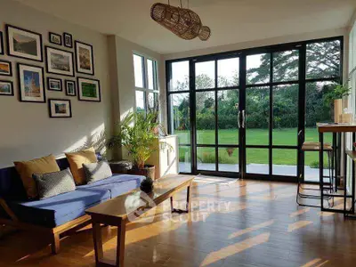 Spacious living room with garden view and modern decor