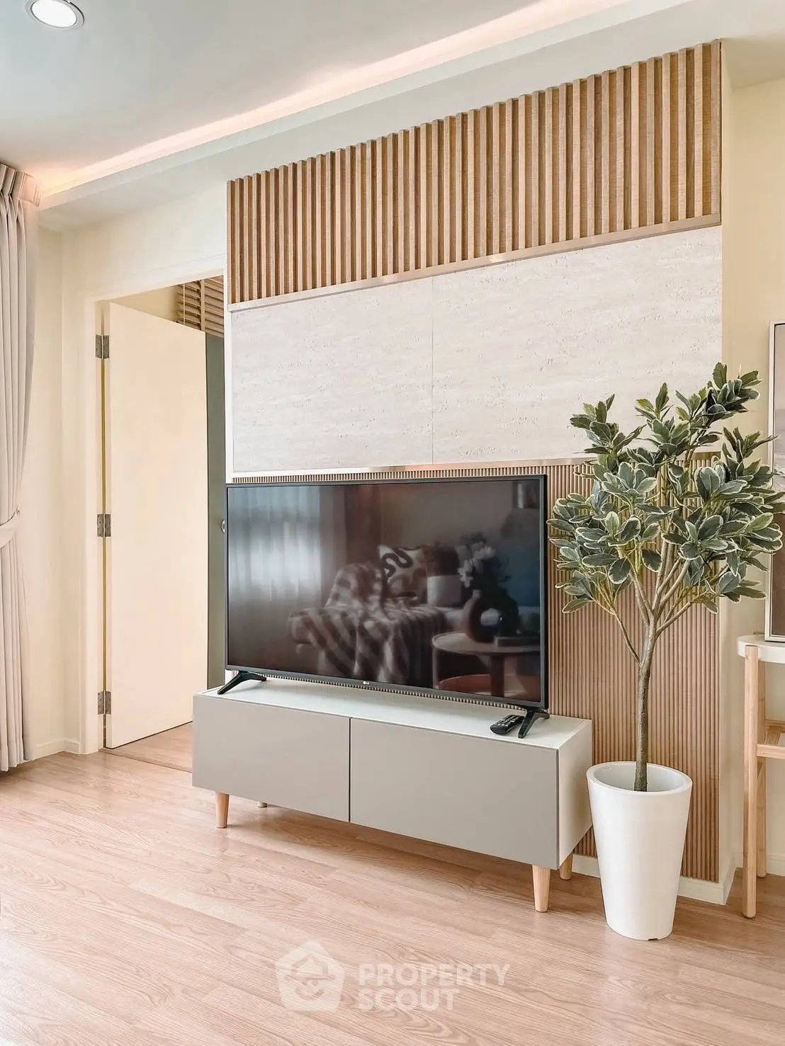 Modern living room with stylish TV setup and elegant decor