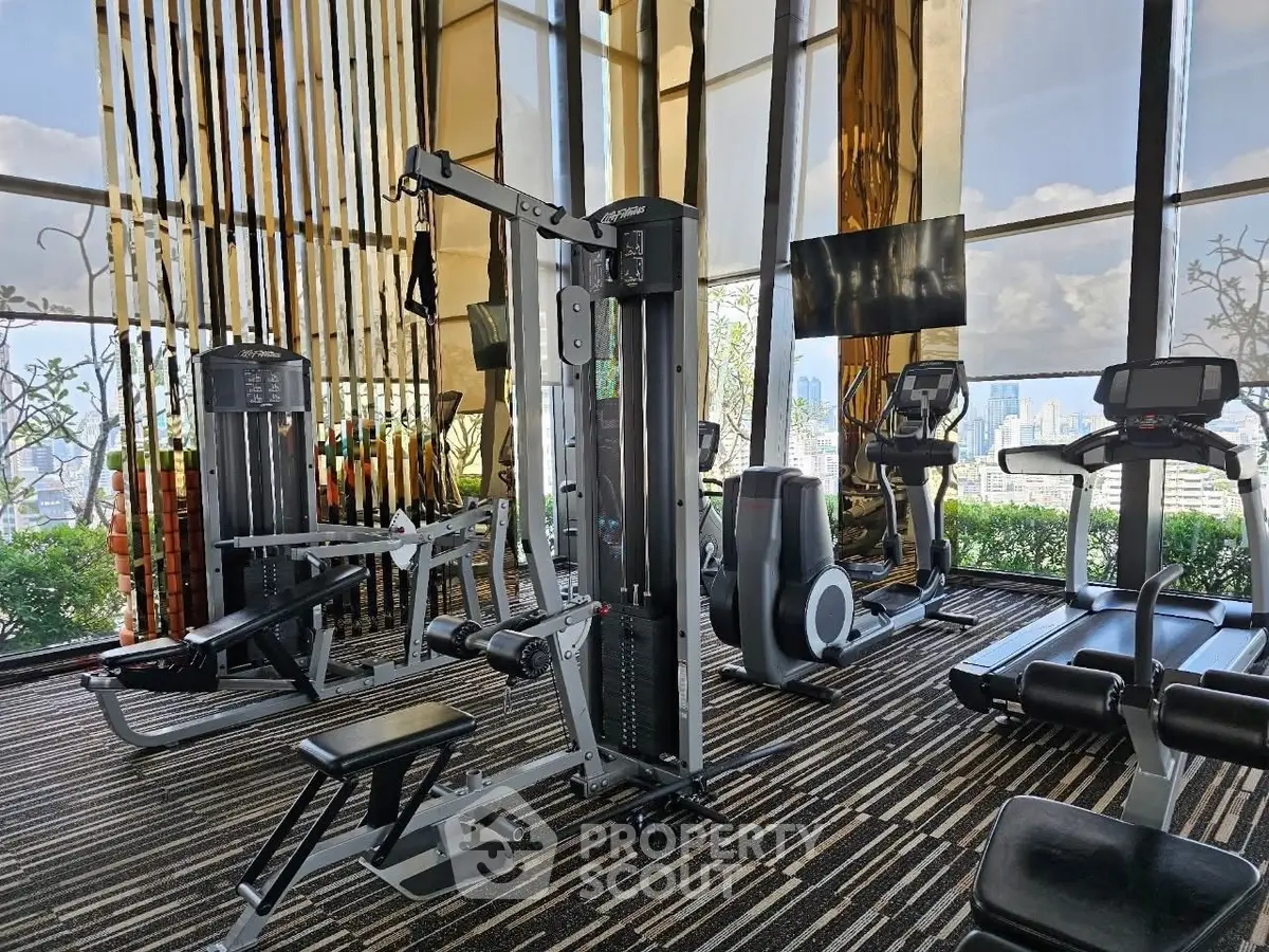 Luxurious high-rise gym with panoramic city views and modern fitness equipment.