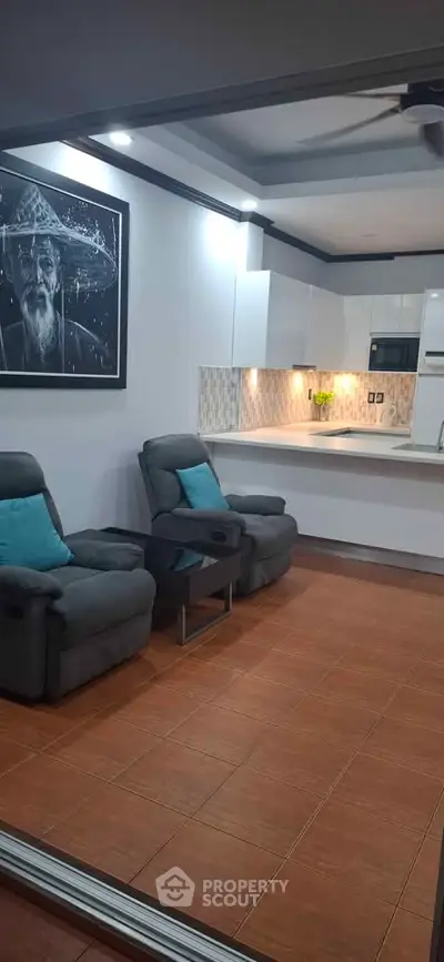 Modern open-layout kitchen with cozy seating and stylish decor