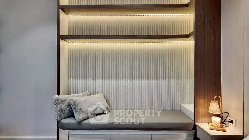 Cozy modern nook with ambient lighting and plush cushions, perfect for relaxation.
