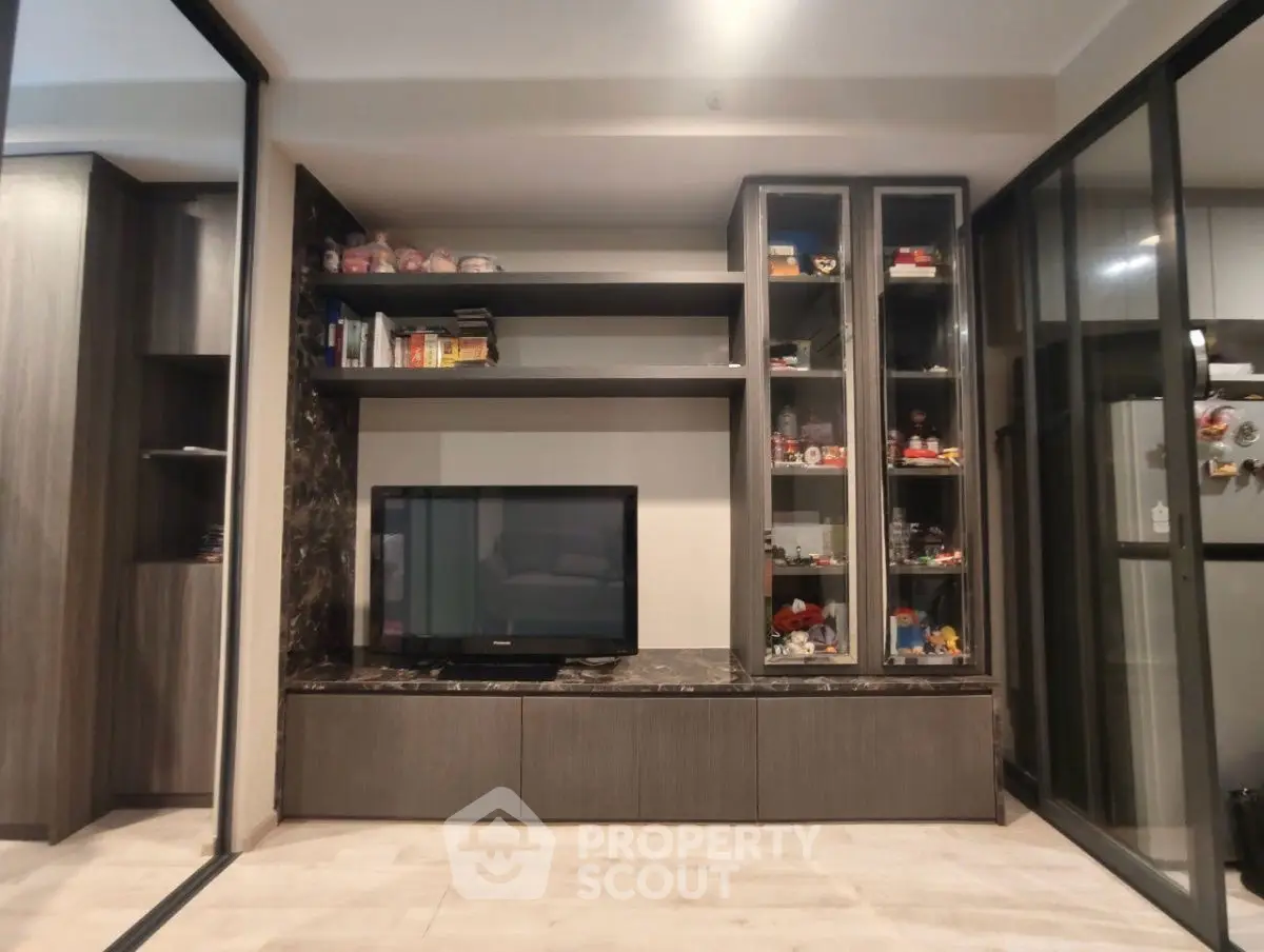 Modern living room with sleek built-in shelves and TV unit
