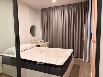 Modern bedroom with stylish decor and comfortable mattress in a cozy apartment.