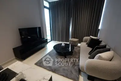Modern living room with stylish furniture and large window for natural light