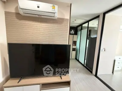 Modern living room with sleek TV and air conditioning in stylish apartment