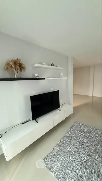 Modern living room with sleek TV setup and minimalist decor