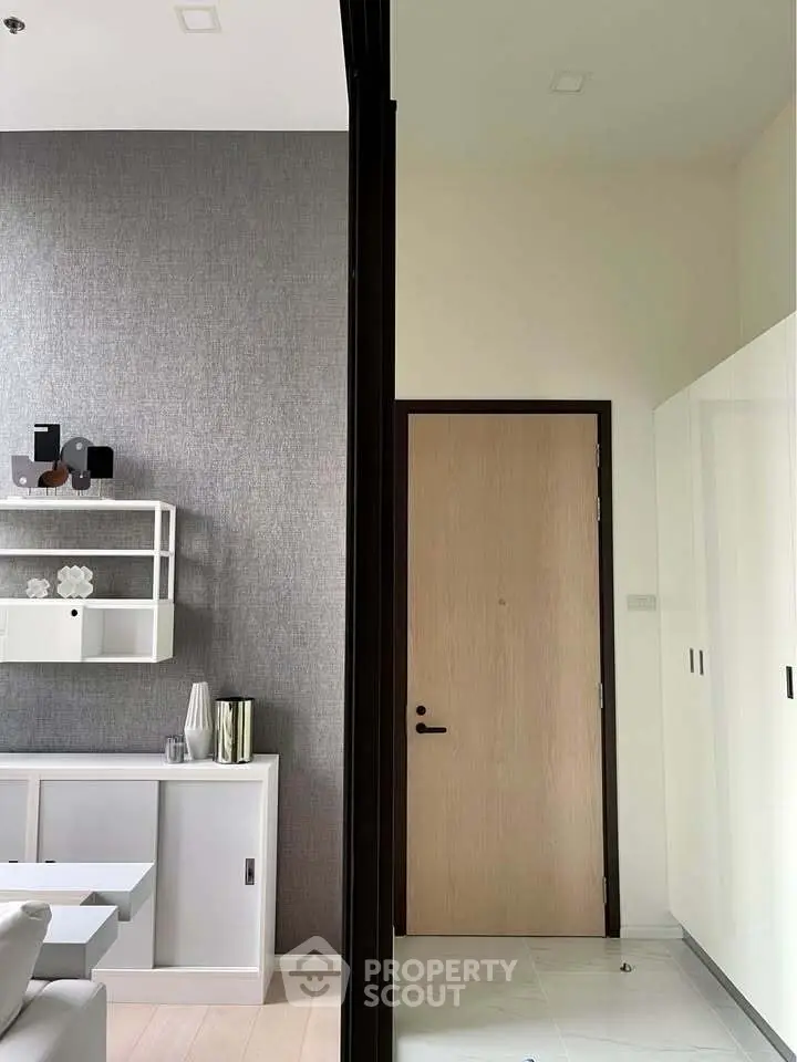 Modern interior with stylish decor and sleek storage solutions in a contemporary apartment.