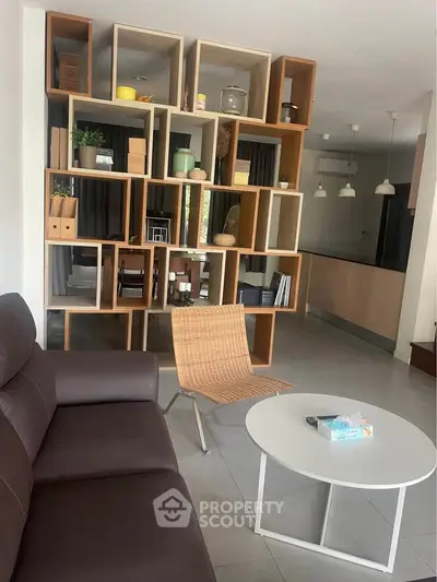 Modern living room with stylish shelving and contemporary furniture