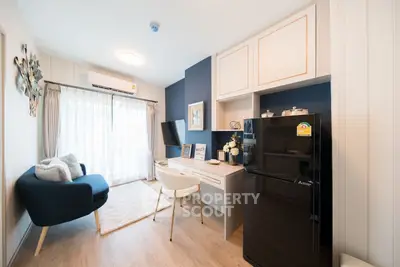 Modern living room with stylish decor and compact workspace