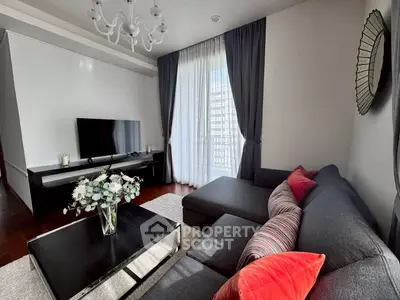 Stylish living room with modern decor and large window for natural light