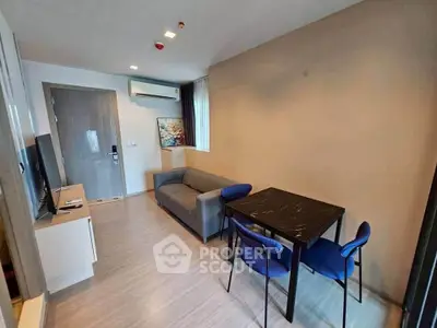 Modern living room with sleek furniture and stylish decor in a contemporary apartment.