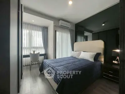 Modern bedroom with stylish decor and natural light