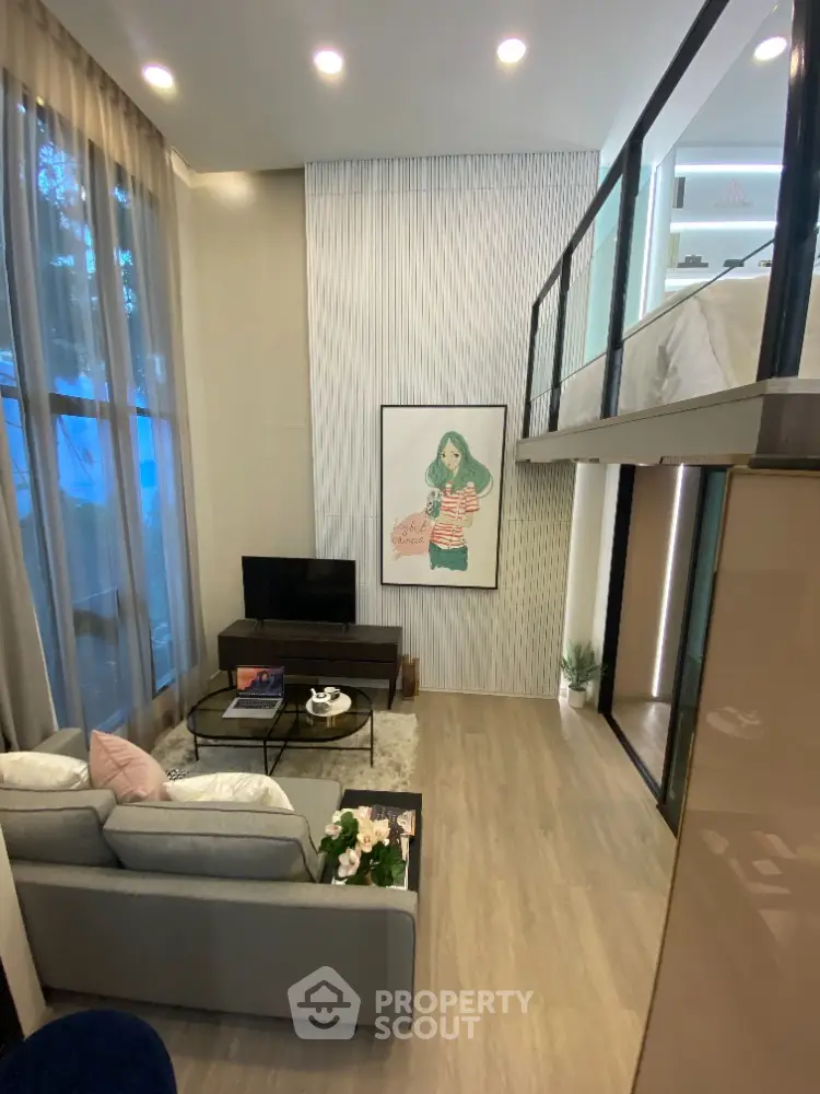 Modern loft-style living room with high ceilings and elegant decor