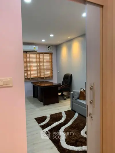 Modern study room with stylish desk and comfortable chair, perfect for productivity.