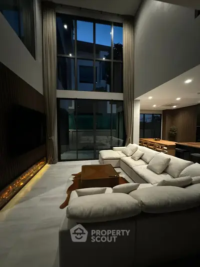 Luxurious modern living room with high ceilings and elegant decor