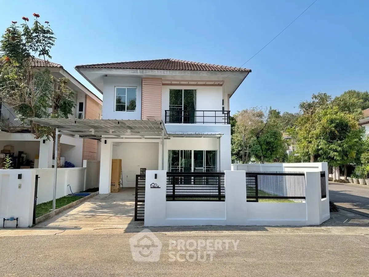 Charming two-story house with modern design and spacious driveway in a serene neighborhood.