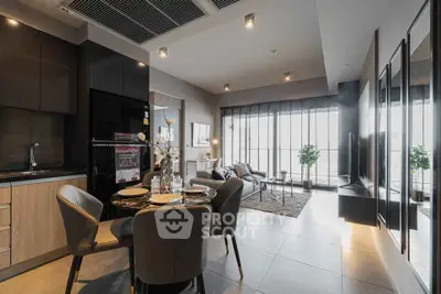 Modern open-layout living room with dining area and large windows in a stylish apartment.