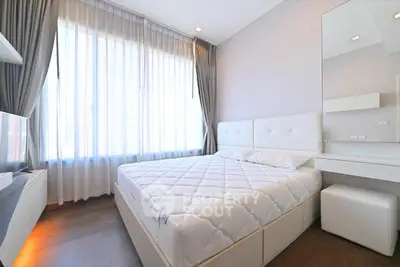 Bright and modern bedroom with large windows and stylish decor