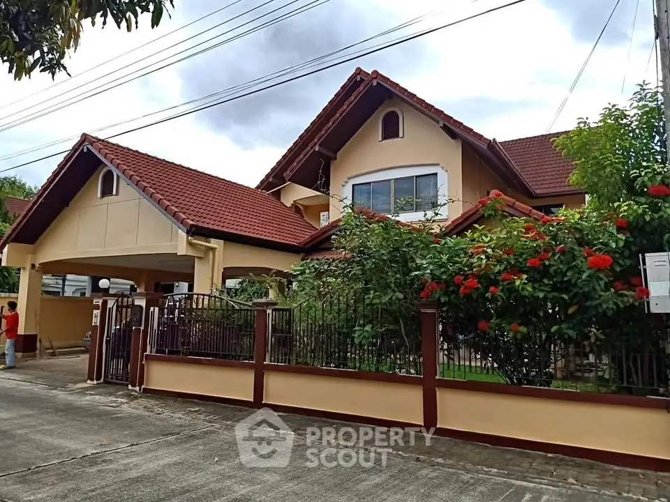Charming suburban house with red roof and lush garden in a peaceful neighborhood.