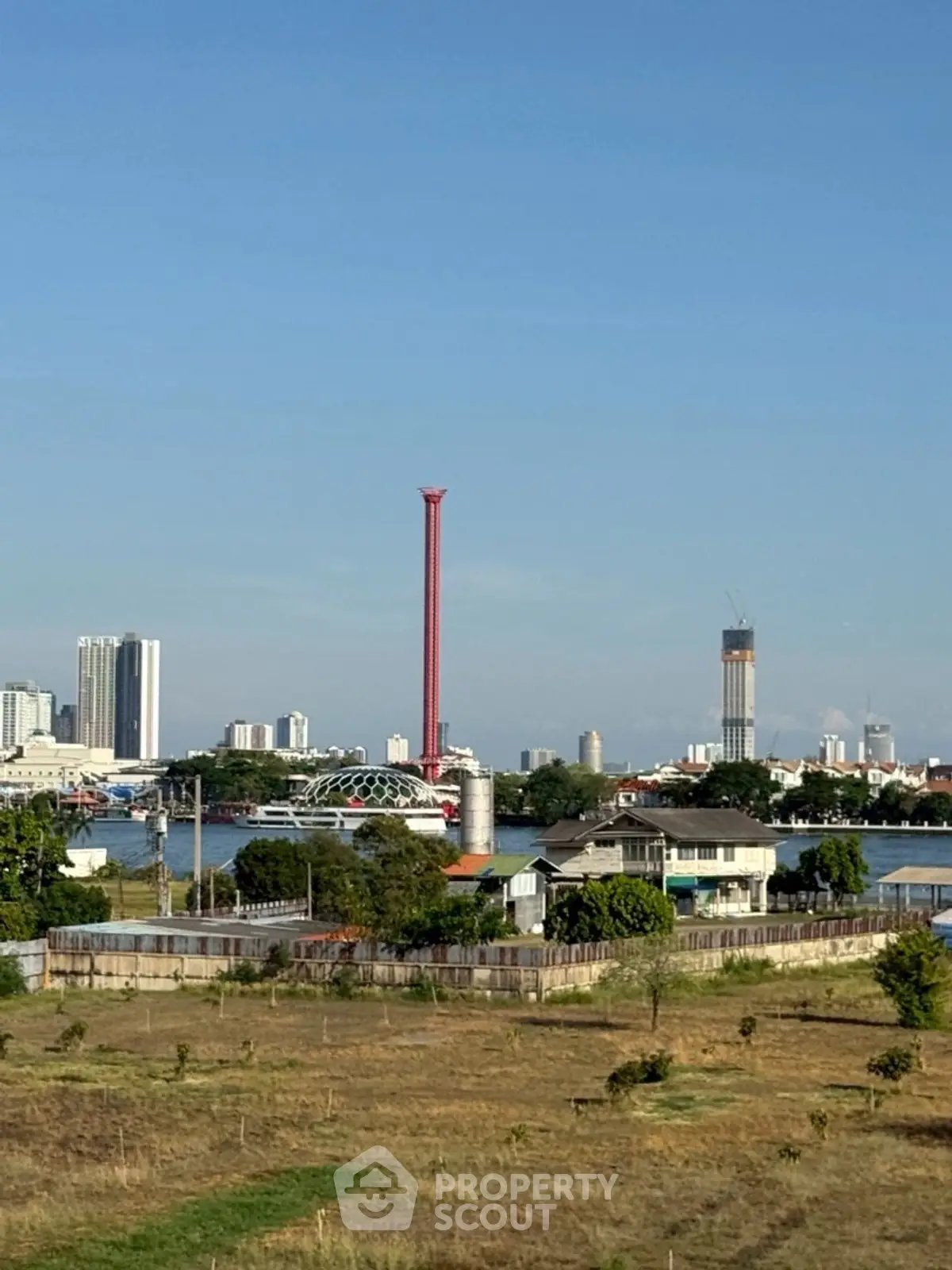 Scenic cityscape view with river and skyline, perfect for urban living enthusiasts.