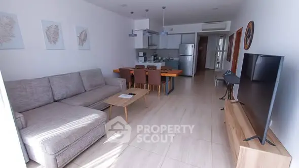 Spacious modern living room with open kitchen and stylish decor
