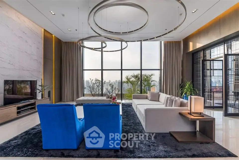 Luxurious modern living room with floor-to-ceiling windows and stylish decor