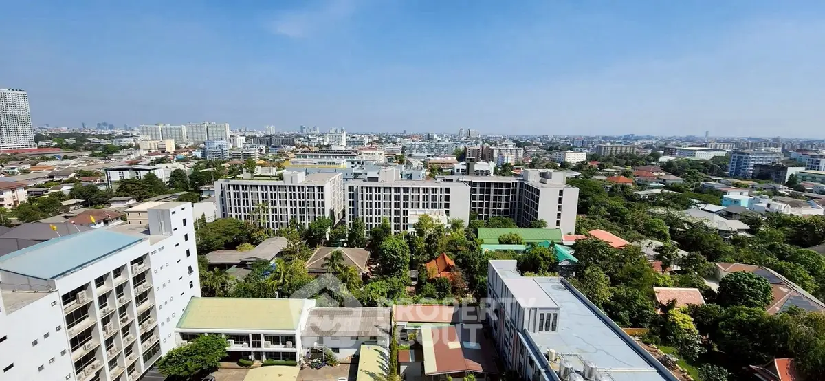 Stunning aerial view of urban landscape with modern buildings and lush greenery.