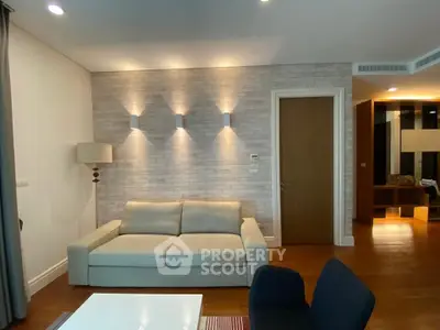 Modern living room with cozy sofa and stylish lighting