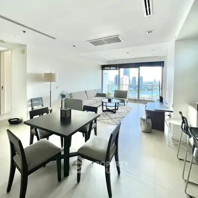 Spacious modern living room with city view and elegant furnishings